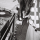 A woman in a record store standing over a turntable